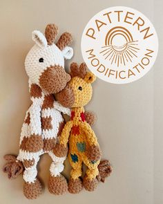 two crocheted giraffes sitting next to each other