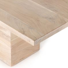 a close up of a wooden table on a white background with no one around it