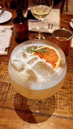 a close up of a drink in a glass on a table