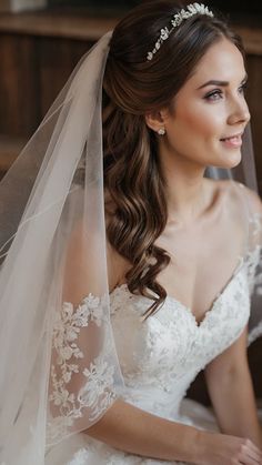 a woman in a wedding dress with a veil on her head