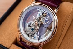 DESCRIPTION: This is a fine classic mechanical watch. It does not require battery. All the parts on this watch is beautifully crafted. Cool thing about this watch is that you can actually see through front to back, to sides and you can enjoy all the gears move inside the watch. COLOR: ROSE GOLD WITH PURPLE LEATHER STRAP WITH DEPLOYANT BUCKLE WATCH CASE SIZE: 43MM DISPLAY: ANALOG CASE: STAINLESS STEEL MOVEMENT: AUTOMATIC WATER RESISTANCE RATING: 3ATM (30 METERS) PACKAGE INCLUDES: WATCH, MANUAL, Q Elegant Automatic Watch Accessories For Gift, Elegant Watch Accessories With Rotating Bezel As Gift, Rose Gold Automatic Watch As A Gift, Rose Gold Automatic Watch As Gift, Rose Gold Automatic Watch For Gift, Rose Gold Watches With Skeleton Dial As Gift, Rose Gold Watch With Skeleton Dial As Gift, Rose Gold Automatic Watch Gift, Rose Gold Watch Accessories With Skeleton Dial As Gift