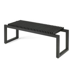 a black bench sitting on top of a white floor