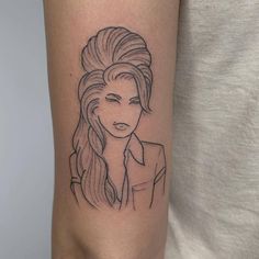 a woman's arm with a black and white line drawing of her face on it