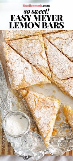 lemon bars are stacked on top of each other with powdered sugar in the middle