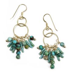 Add a touch of natural beauty and elegance to your outfit with these exquisite handmade dangle earrings. Featuring genuine turquoise beads in a stunning array of shades, these earrings are a perfect blend of style and sophistication. The turquoise beads are complemented by delicate glass seed beads and yellow gold filled findings, creating a captivating and eye-catching piece. Materials: Genuine turquoise beads, glass seed beads, yellow gold filled findings, gold filled ear wires Length:  About 2.25 Inches Handmade with Love: These earrings are crafted with attention to detail, ensuring a high-quality and unique piece. Perfect for Any Occasion: Whether you're dressing up for a special event or adding a touch of glamour to your everyday look, these earrings are the perfect accessory.    Not Elegant Turquoise Beaded Dangling Earrings, Bohemian Drop Earrings With Gemstone Beads, Elegant Turquoise Chandelier Earrings With Round Beads, Elegant Turquoise Chandelier Earrings, Turquoise Dangle Beaded Earrings, Turquoise Beaded Earrings With Natural Stones, Handmade Dangle Earrings, Bead Dangle Earrings, Turquoise And Gold