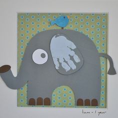 an elephant with a blue bird on top of it