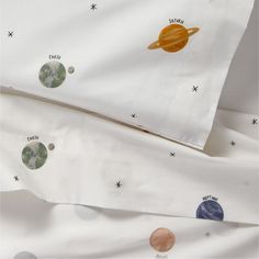 two sheets with planets printed on them