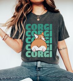 Looking for the perfect gift for a corgi-loving mom? Check out our Corgi Mom Shirt - a hilarious and adorable tee that features a cute Corgi butt graphic. This funny corgi shirt is the perfect present for any dog fur mama and makes a great addition to any dog owner's wardrobe. Our Kawaii corgi t-shirt is not only stylish but also comfortable to wear, making it the ideal choice for any casual occasion. Get your hands on this must-have dog shirt today and show off your love for corgis in style! Professionally printed t-shirts, perfect for anyone looking for comfortable and stylish everyday wear. Our t-shirts are made from 100% cotton (excluding heather colors) and feature a comfortable, relaxed fit that's perfect for any occasion. With a variety of trendy designs to choose from, there's a t- Cute Dog Print Cotton Top, Cute Cotton Tops With Dog Print, Cute Cotton Top With Dog Print, Cute Dog Print Crew Neck Top, Cute Dog Print Short Sleeve Tops, Cute Crew Neck Top With Dog Print, Cute Short Sleeve Tops With Dog Print, Corgi Stuff, Kawaii Corgi