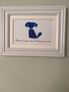 a white frame with a blue dog on it