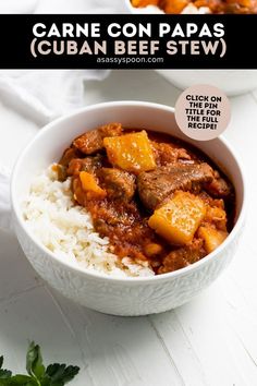 two bowls filled with rice and stew on top of a white tablecloth next to another bowl