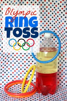 the olympic ring tosser is next to a bottle of water and an orange tube