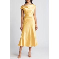 a woman is wearing a yellow dress with one shoulder and the other side has an asymmetrical design