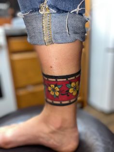 a person with a tattoo on their leg