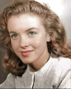 an old photo of a woman with blue eyes