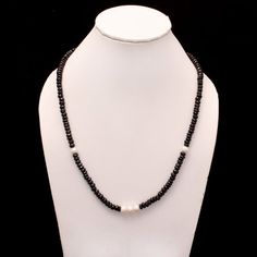 Product Details : ITEM : BLACK SPINEL AND PEARL BEADED NECKLACEItem Code : DGC2513Gemstone Name :  BLACK SPINEL, PEARLChain Style : BEADEDBeads Shape : FACETED RONDELLEBeads Size : 5-6/7 mm Approx.Length : 20 INCH WITH LOBSTER CLASPWeight : 170 Cts. Approx.Customization : **Available**Please Feel Free To Contact If You Have Any Query. Black Rondelle Beaded Necklaces, Black Beaded Rondelle Necklace, Black Rondelle Gemstone Bead Necklace, Black Beaded Rondelle Jewelry, Handmade Black Pearl Necklace With Round Beads, Handmade Black Pearl Beaded Necklaces, Black Pearl Necklace With Round Beads As Gift, Black Pearl Necklace For A Gift, Black Rondelle Gemstone Beaded Necklace