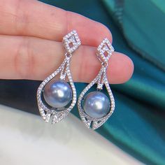 Beautiful Tahitian Gray Pearl Earrings, 10.2mm, Beautiful Gray Color,  High Luster.  Sterling Silver S925 with sparking cubic zircons, well made and comfortable to wear.  Stunning and Elegant   Super Value!  Pearl ★ Pearl: Genuine Tahitian pearl, saltwater ★ Size: 10.2mm ★ Shape: Near Round ★ Color: Natural untreated, Beautiful Gray Color ★ Luster: High Luster ★ Surface: Nice, Baby smooth and Mirror like, Mostly Very Clean, gentle texture Earrings ★ Metal: Sterling Silver S925 with sparking cubi Grey Pearl Earrings, Nice Baby, Ear Drops, Earrings Metal, Tahitian Pearls, Pearl Grey, Chain Ring, Tahiti, Pearl Bracelet