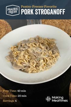 a white bowl filled with pasta on top of a table