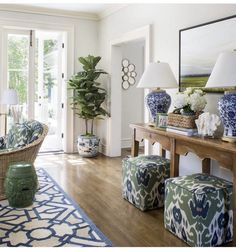 a living room with blue and white decor