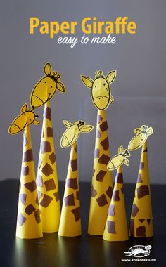 paper giraffes are lined up in the shape of cones with text overlay that reads, paper giraffe easy to make