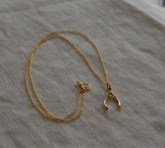 The Wishbone is a classic talisman for luck and making wishes come true. The wishbone charm is made out of solid Bronze metal and is paired with a 14K Gold Filled Chain for affordability. Choose either a 16” chain or 18” chain. Is it a gift? Gift packaging available at check out. 14K Gold Filled Chain for the US, Lead and Nickel Free. Bronze Wishbone measures 3/8” wide by 5/8” high Assembled in our studio in Portland, OR Wishbone Necklace Gold, Wishbone Necklace, Bronze Metal, Christmas Mood, Gold Filled Chain, Gift Packaging, Gold Filled, Gold Bracelet, Chain