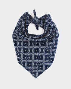 a blue bandana with white circles on it