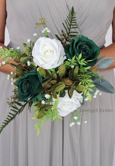 a bridesmaid holding a bouquet of white and green flowers