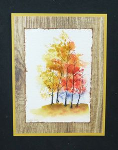 a watercolor painting of three trees in the fall