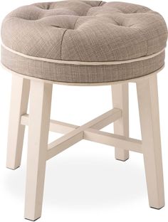 a white stool with a beige cushion on it