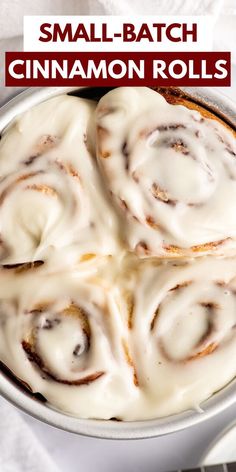 a pan filled with cinnamon rolls on top of a table