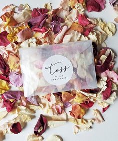 dried flower petals are scattered around the package