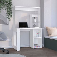 a computer desk with a laptop on top of it next to a white bookcase