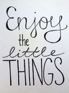 the words enjoy the little things written in black ink on white paper, with an image of