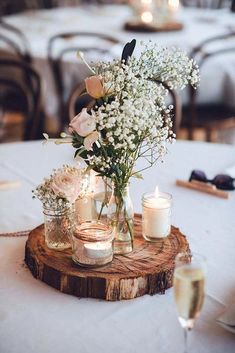 an instagram page with flowers and candles on the table in front of some other items