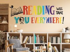 there is a wall decal that says reading will take you everywhere