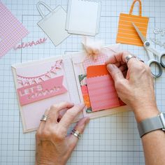 someone is making a card with paper and scissors