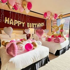 two beds with pink and gold balloons on them in a room decorated for a 30th birthday