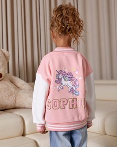 Personalized Children's Varsity Unicorn Jacket - Custom Name Kids Bomber Coat Sport Team Uniforms, Sport kids jacket with Patches Name  ✨"Customized Kids Varsity Jacket with Personalized Name - Youth Letterman Style Introducing our Kids Personalized Varsity Jacket, the perfect addition to your little one's stylish wardrobe! Made with high-quality materials, this jacket is not only fashionable but also super cozy and comfortable. Whether your child is heading to school, a playdate, or sports prac Multicolor Cartoon Print Outerwear With Long Sleeves, Multicolor Long Sleeve Outerwear With Cartoon Print, Multicolor Cartoon Print Long Sleeve Outerwear, Pink Outerwear With Cartoon Print For Fall, Pink Cartoon Print Outerwear For Fall, Fall Pink Outerwear With Cartoon Print, Pink Long Sleeve Outerwear With Cartoon Print, Multicolor Long Sleeve Outerwear For School, Jacket With Patches