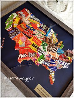 a framed map of the united states made out of candy bars and soda cans is shown