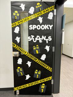 a door decorated with yellow and black tape that says spooky supens