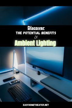 a computer desk with a monitor and keyboard on it, next to a lamp that reads discovery the potential benefits of ambient lighting