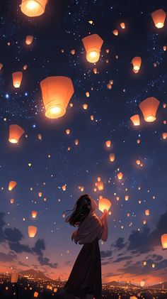 a girl looking up at lanterns floating in the sky