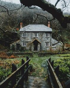 an old stone house in the woods