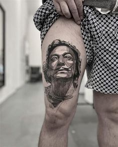 a man with a tattoo on his leg