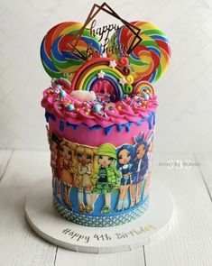 a colorful birthday cake decorated with cartoon characters