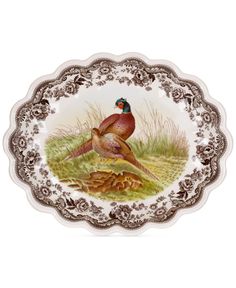 a plate with a bird painted on it