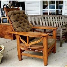 a wooden chair sitting on top of a sidewalk