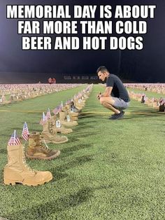 a man kneeling down in front of many pairs of boots with flags on them and the caption memorial day is about far more than cold beer and hot dogs