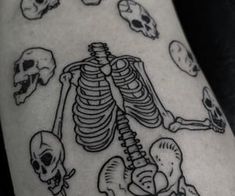 a man with a skeleton tattoo on his arm