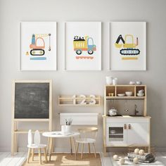 three framed pictures on the wall above a table and chairs in a child's room