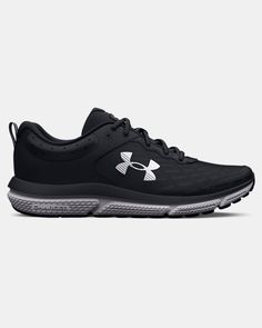 the under armour shoes are black and white